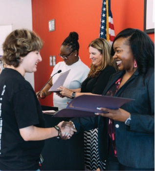 Scholarship recipients at a Beyond Housing Foundation celebration